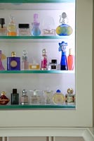 Perfume bottles in display cabinet