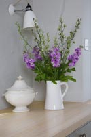 Flower arrangement in white jug