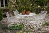 Wirework garden furniture on patio