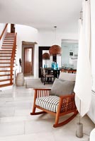 Wooden rocking chair in open plan room