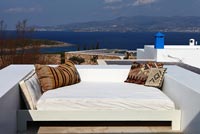 White daybed overlooking sea