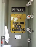 Toilet with vintage signs