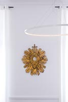 Antique gilded mirror and minimal pendant light by  Jean Luc le Deun 