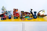 Colourful ceramics on Ikea cabinet