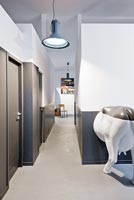 Contemporary hallway with cow sculpture