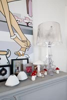 Grey mantlepiece with toadstool ornaments