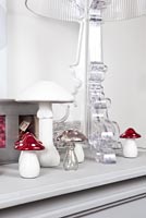 Grey mantlepiece with toadstool ornaments