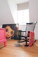 Rocking chair and Blythe doll painting in girl's bedroom