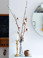 Arrangement of catkins and stems in glass vase