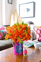 Colourful flowers on wooden coffee table