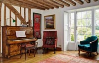 Country living room with piano