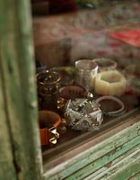 Bracelet collection in distressed cabinet