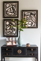 Modern art above oriental style console table
