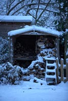 Wood store in snow
