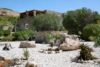 Traditional stone house and gravel garden
