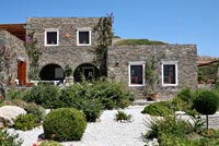 Traditional stone house and gravel garden 
