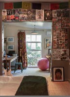 Eclectic bedroom with office space