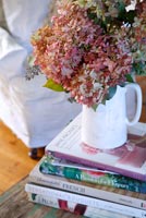 Hydrangea flowers in white jug