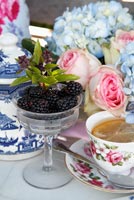 Afternoon tea with cut Roses and Hydrangeas