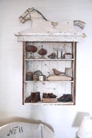 Vintage accessories displayed in wooden cabinet