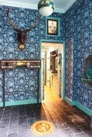 Blue floral wallpaper in hall