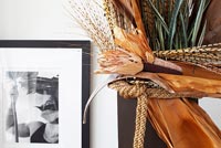 Dried foliage and quill arrangement