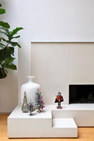 Traditional Christmas decorations on minimal fireplace