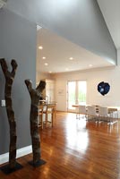 Wooden sculptures in contemporary open plan space