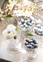 Flowers and ornaments in glasses