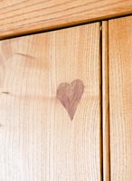 Wooden kitchen units with heart shaped motif