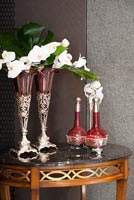 Glass vases on marble side table