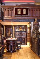 Open plan dining room filled with antiques