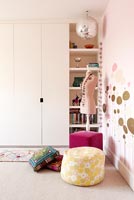 Girl's bedroom with stencilled walls
