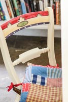 Painted chair with patchwork cushion