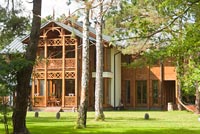 Timber Swidermajer building and woodland garden
