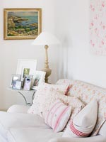 Linen sofas with homemade cushions and vintage quilt