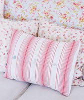 Homemade cushions and vintage quilt
 