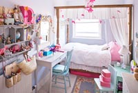 Girl's bedroom with four poster bed