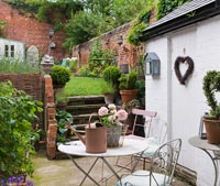 Small courtyard and garden with vintage furniture