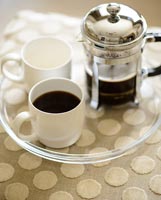 Coffee on spotted ottoman