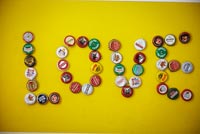 Love spelled out with bottle tops