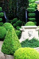 Formal garden with topiary and water feature