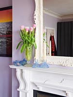 Glass accessories on mantlepiece