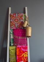 Colourful fabrics on ladder
