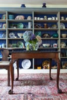 Country dining room with ceramics display