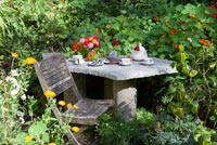 Compact patio surrounded by Nasturtiums