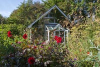 Country house and garden with Dahlias and grasses
