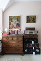 Wooden chest of drawers and vintage suitcases