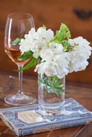 Posy of white flowers in glass