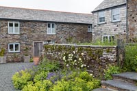 Stone house and garden with drystone walls
